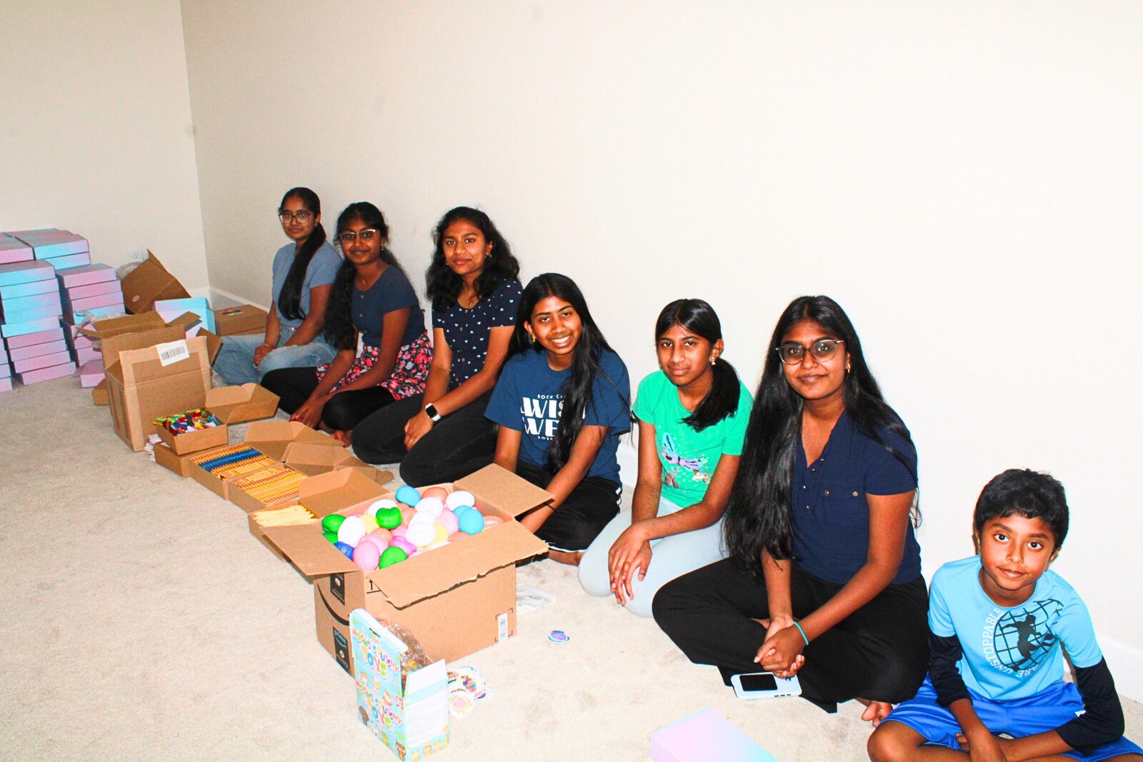 Volunteer team smiling together during the packing session