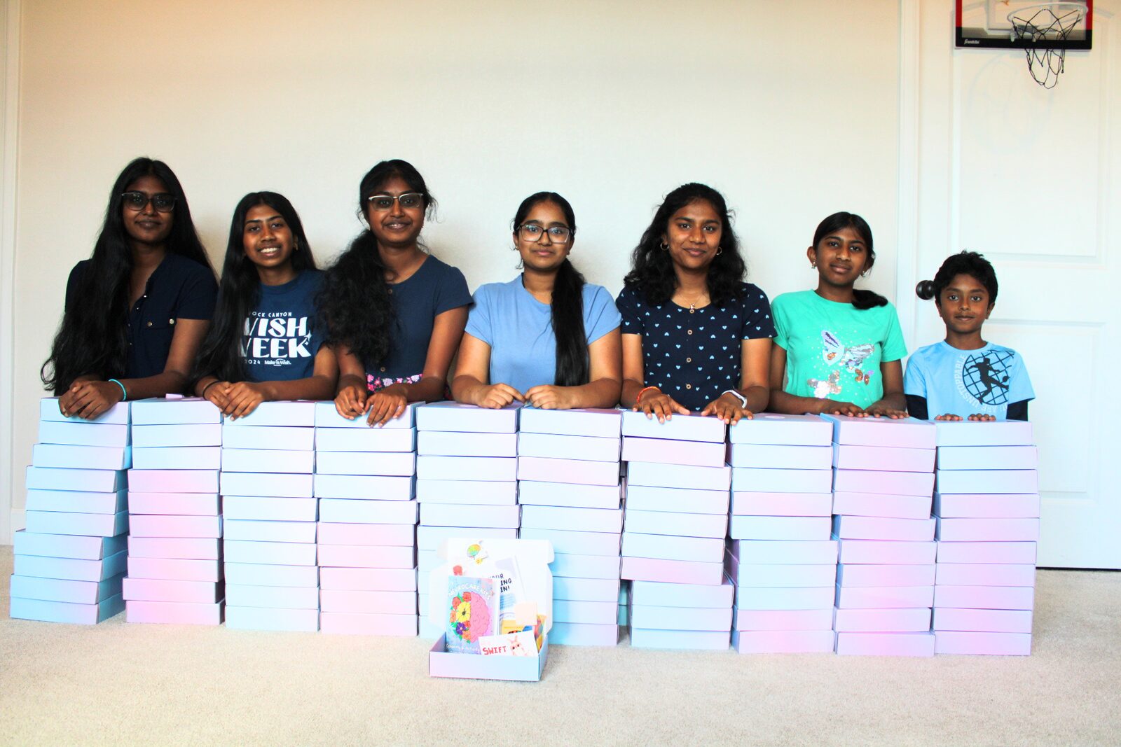 Volunteer team posing with packing supplies