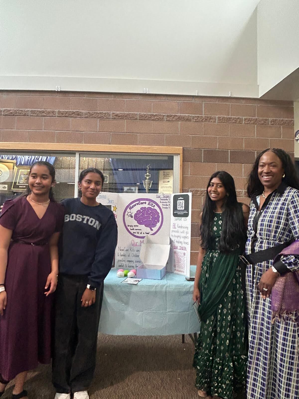 Team members posing with community supporters