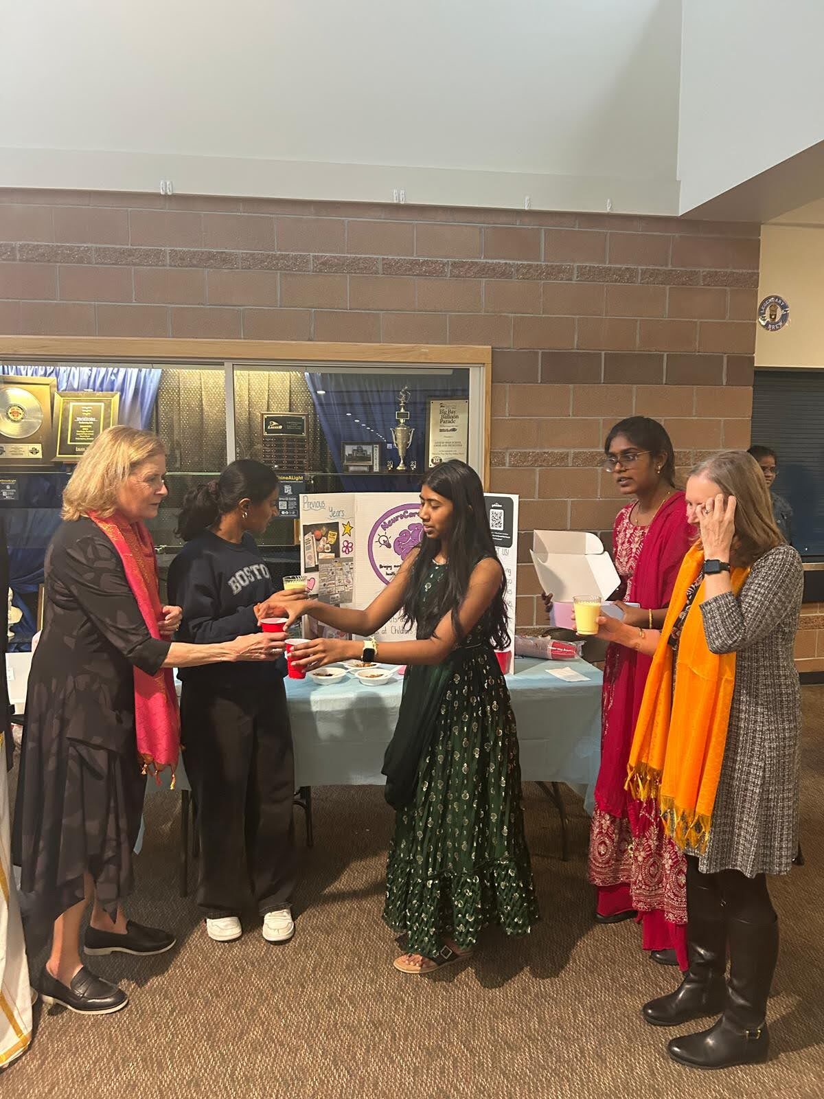 Guests receiving snacks from the fundraiser table