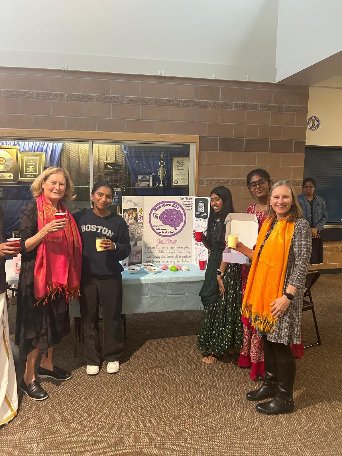 Team members with supporters at the fundraiser